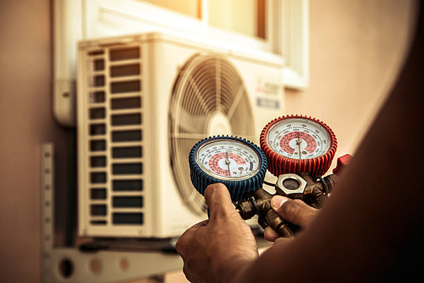 Professional Hvac technician working in Amazonia, MO